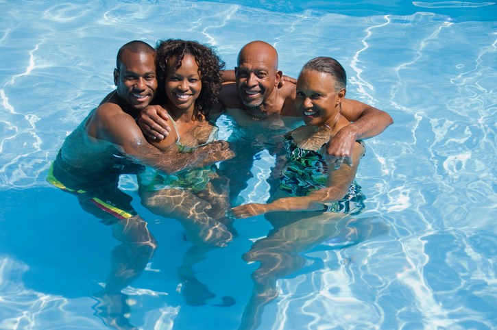 African American family in swimming pool