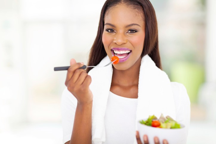 woman eating salad