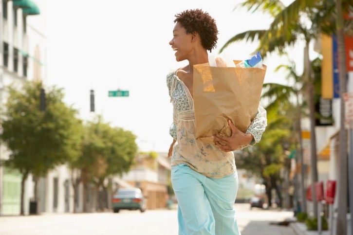 Woman Walking carrying groceries