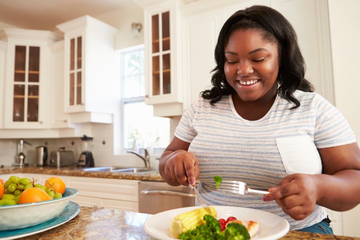 overweight woman eating