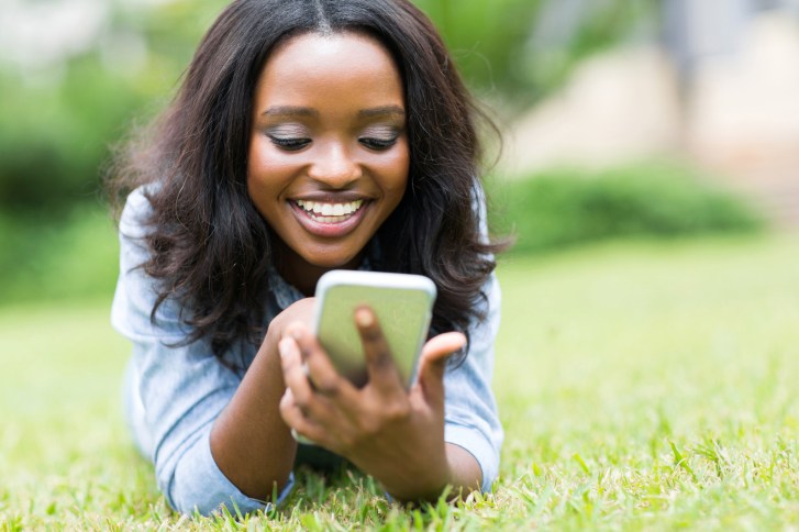 young woman outside on phone