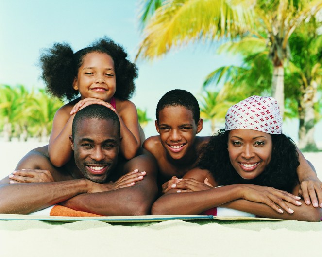 portrait of family lying on beach