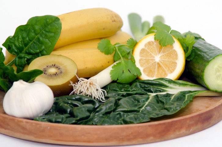 fruit and spinach in a bowl