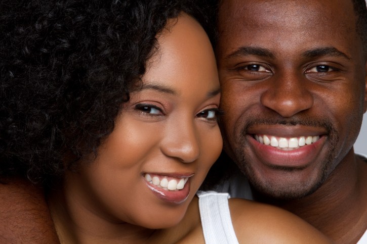 african american man and woman smiling