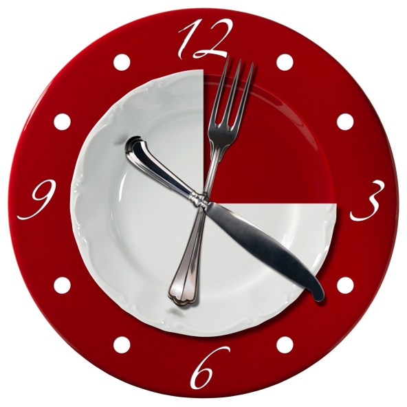 wall clock made from a plate and fork and knife represent the hands