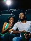 couple watching movie in theater