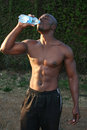 flat tummy fitness man drinking water