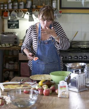 Woman Cooking In Kitchen