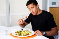 Man eating salad