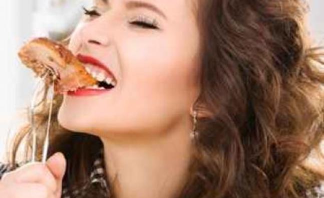 woman_eating_steak_765272494_detail.jpg