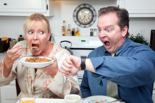 Late for Work Stressed Couple Checking Time in Kitchen.