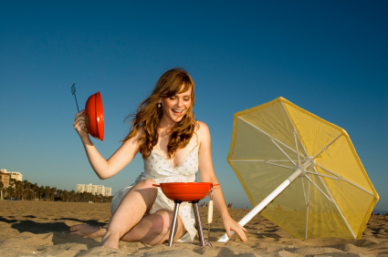 woman grilling on beach.jpg