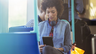 woman-commute-train-headphones