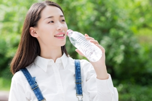 young girl drinking water